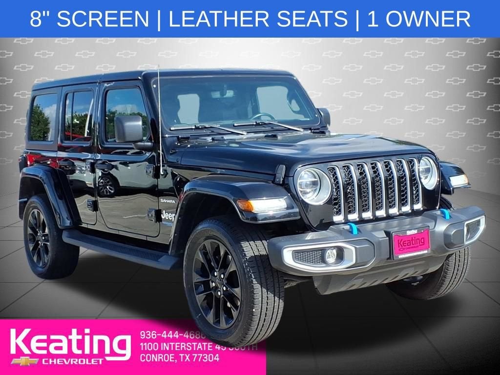 2022 Jeep Wrangler 4xe Unlimited Sahara 4x4 in Black — front three-quarter view