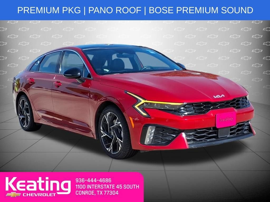 2025 Kia K5 GT-Line in Red — front three-quarter view